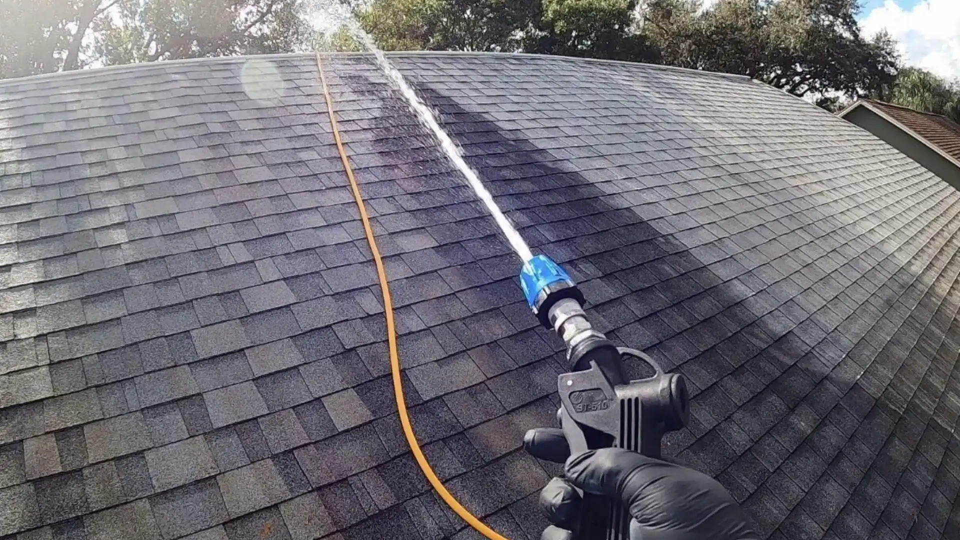 roof cleaning apollo beach technician performing soft wash service